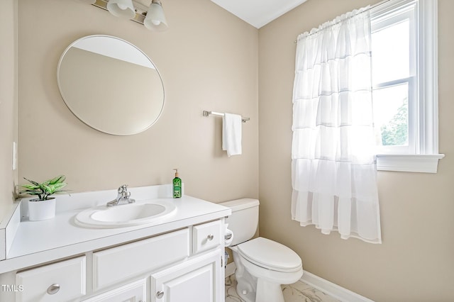 4702 Pleasant Green Rd, Durham, NC 27705 - bathroom with vanity, toilet, marble look tiles, and baseboards