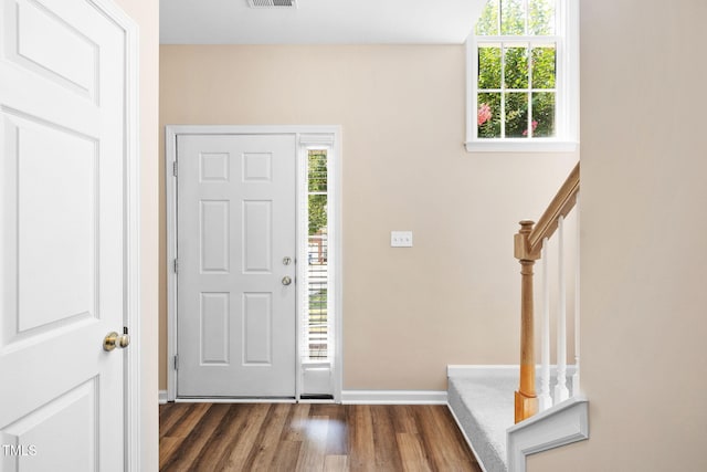 5644 Picnic Rock Ln, Raleigh, NC 27613 - entrance foyer featuring dark wood finished floors and stairway