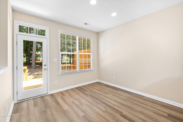 5644 Picnic Rock Ln, Raleigh, NC 27613 - entryway with wood finished floors and recessed lighting