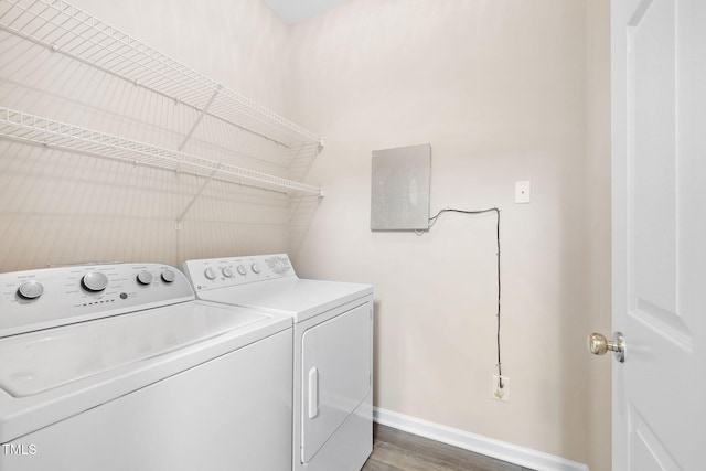 5644 Picnic Rock Ln, Raleigh, NC 27613 - laundry area with washing machine and clothes dryer and wood finished floors