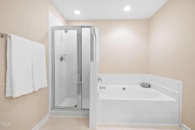 5644 Picnic Rock Ln, Raleigh, NC 27613 - full bathroom featuring a stall shower, a garden tub, recessed lighting, and tile patterned flooring