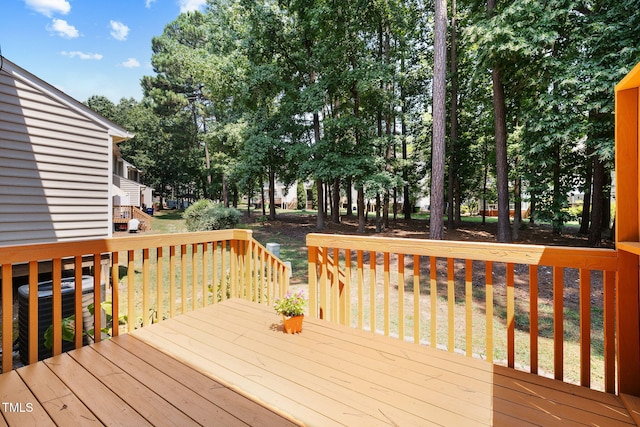 5644 Picnic Rock Ln, Raleigh, NC 27613 - wooden terrace featuring view of scattered trees