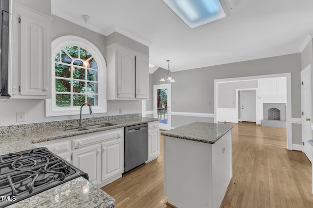 6201 Bayswater Trl, Raleigh, NC 27612 - kitchen with dishwasher, a sink, a center island, light stone counters, and white cabinets