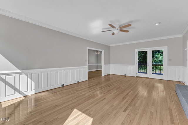 6201 Bayswater Trl, Raleigh, NC 27612 - spare room with ceiling fan, light wood finished floors, wainscoting, and crown molding