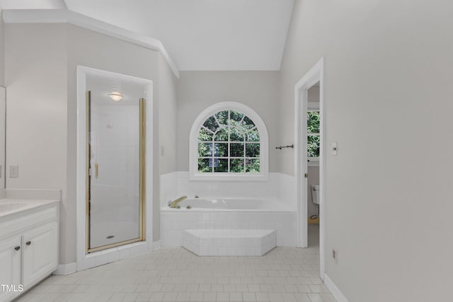 6201 Bayswater Trl, Raleigh, NC 27612 - bathroom with vanity, a bath, a stall shower, tile patterned flooring, and toilet