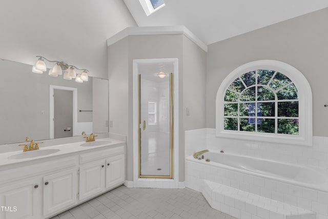 6201 Bayswater Trl, Raleigh, NC 27612 - full bathroom featuring a skylight, a bath, double vanity, tile patterned flooring, and a stall shower