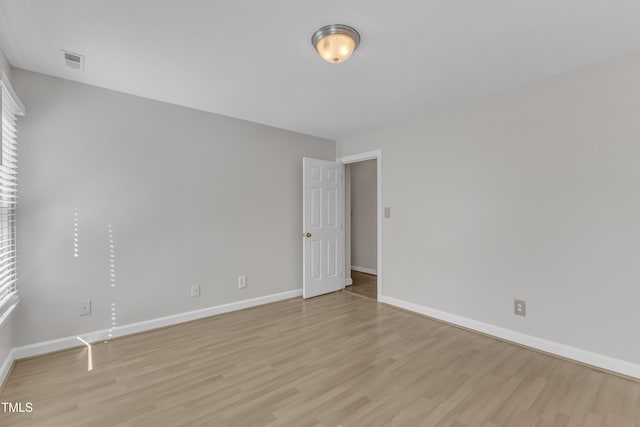6201 Bayswater Trl, Raleigh, NC 27612 - empty room with light wood-style floors and baseboards