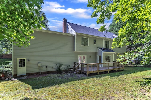 6201 Bayswater Trl, Raleigh, NC 27612 - rear view of property with a chimney, a yard, and a deck