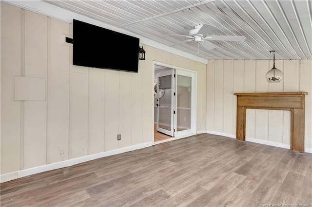 1519 Magnolia Dr, Fairmont, NC 28340 - unfurnished living room featuring ceiling fan, wood finished floors, wooden ceiling, and baseboards