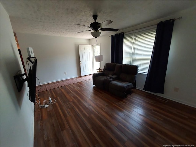 844 Montrose Rd, Raeford, NC 28376 - living area featuring ceiling fan, wood finished floors, baseboards, and a textured ceiling