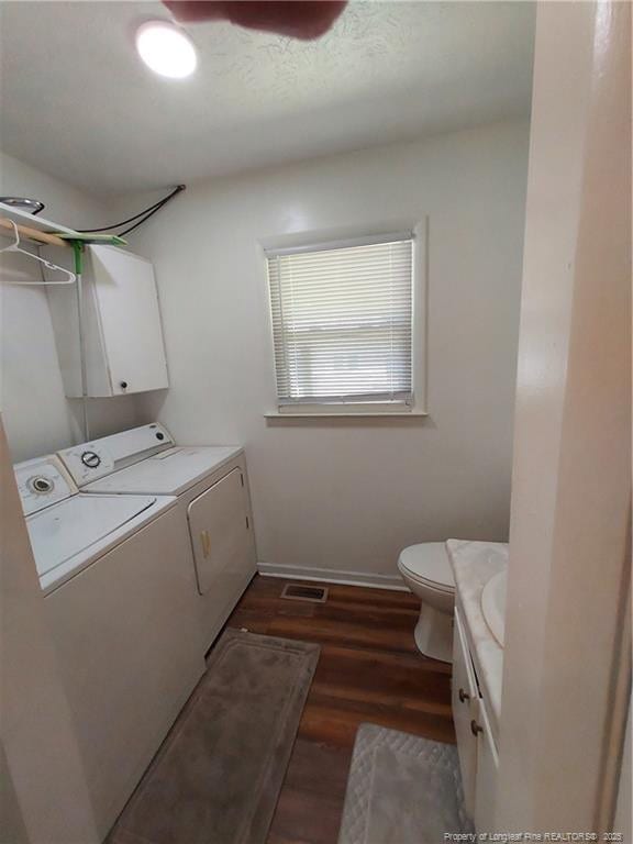 844 Montrose Rd, Raeford, NC 28376 - washroom featuring washing machine and clothes dryer, dark wood-type flooring, and baseboards