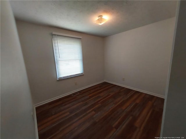 844 Montrose Rd, Raeford, NC 28376 - unfurnished room featuring dark wood-style floors and baseboards