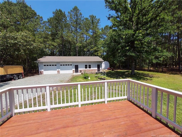 844 Montrose Rd, Raeford, NC 28376 - wooden deck featuring an outdoor structure, a garage, and a yard