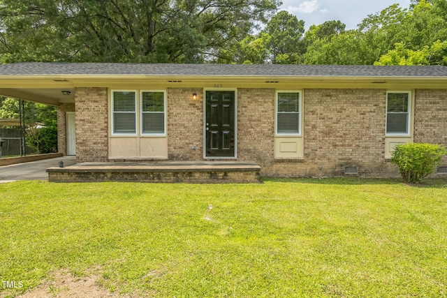 605 Sexton Ave, Zebulon, NC 27597 - single story home featuring brick siding, a front yard, and driveway