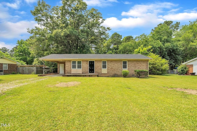 605 Sexton Ave, Zebulon, NC 27597 - view of front of house featuring brick siding and an attached carport