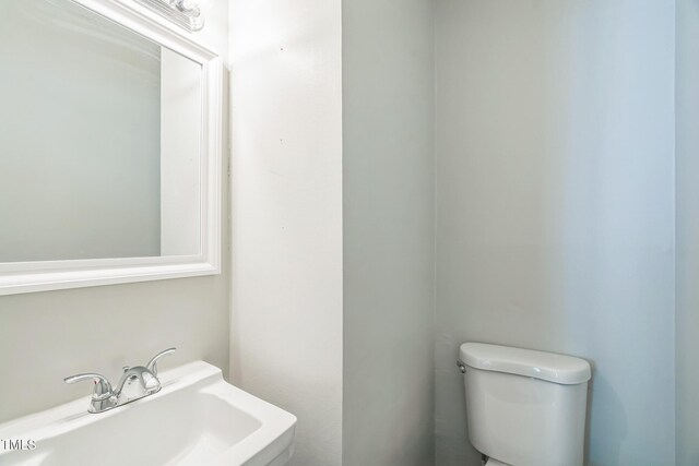605 Sexton Ave, Zebulon, NC 27597 - half bath featuring toilet and a sink