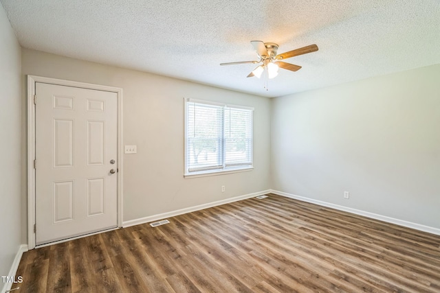 605 Sexton Ave, Zebulon, NC 27597 - entrance foyer featuring ceiling fan, wood finished floors, a textured ceiling, and baseboards