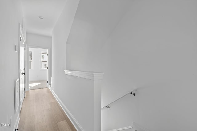 4821 Gossamer Ln Unit 103, Raleigh, NC 27616 - corridor with an upstairs landing, baseboards, and light wood finished floors