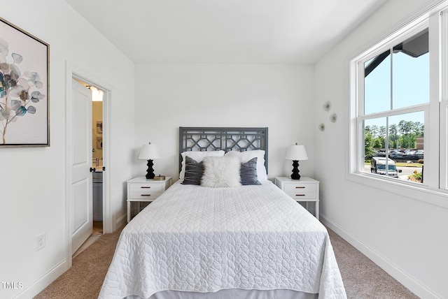 4821 Gossamer Ln Unit 103, Raleigh, NC 27616 - bedroom featuring carpet, baseboards, and ensuite bathroom