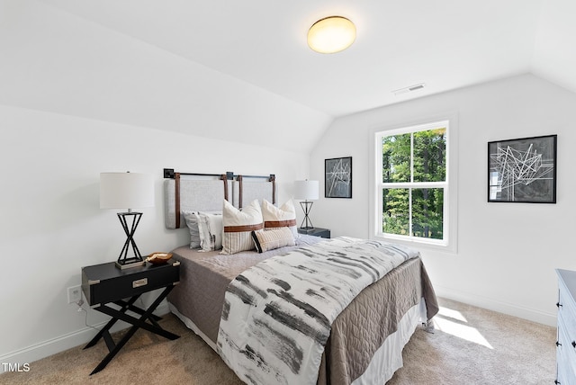 4821 Gossamer Ln Unit 103, Raleigh, NC 27616 - bedroom featuring lofted ceiling, carpet floors, and baseboards