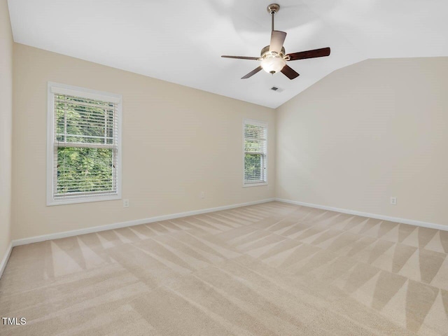 4719 Altha St, Raleigh, NC 27606 - spare room with light colored carpet, baseboards, vaulted ceiling, and a ceiling fan