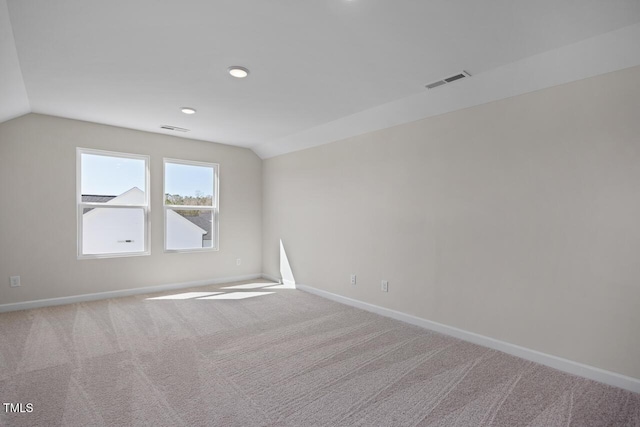 267 Old Fashioned Way, Lillington, NC 27546 - carpeted spare room featuring vaulted ceiling, baseboards, and recessed lighting