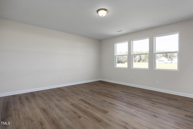 267 Old Fashioned Way, Lillington, NC 27546 - unfurnished room featuring baseboards and dark wood-type flooring