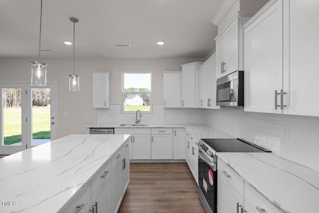 267 Old Fashioned Way, Lillington, NC 27546 - kitchen with stainless steel appliances, white cabinetry, recessed lighting, and decorative backsplash