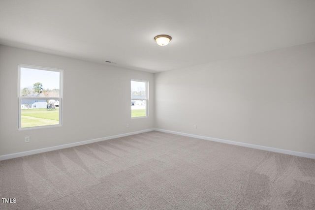 267 Old Fashioned Way, Lillington, NC 27546 - spare room with baseboards and light carpet