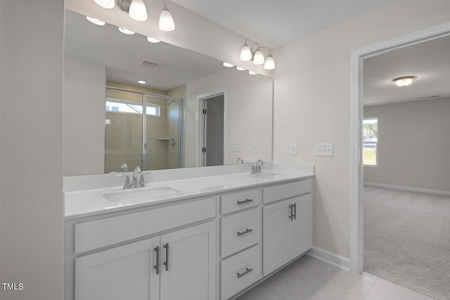 267 Old Fashioned Way, Lillington, NC 27546 - full bathroom featuring double vanity, a shower stall, baseboards, and tile patterned flooring