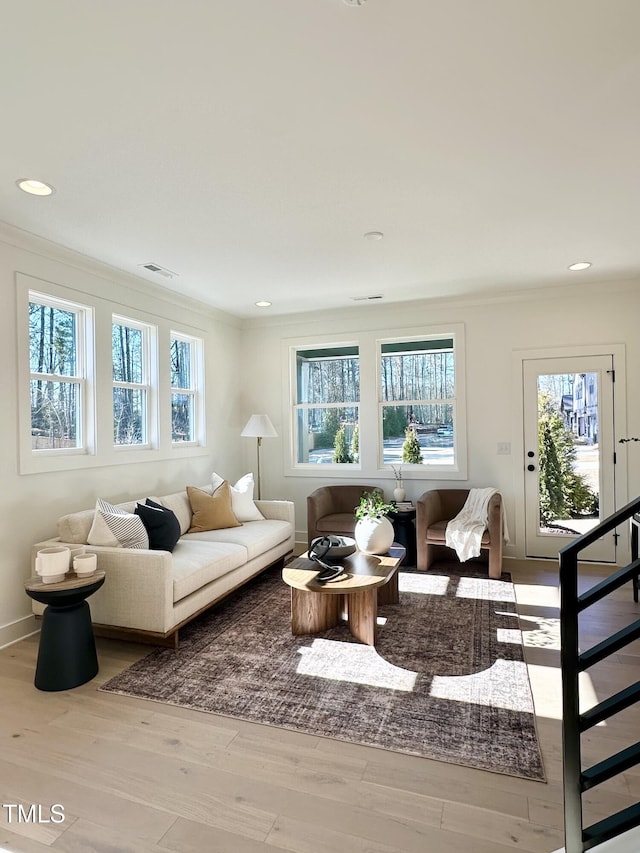 974 Double Helix Rd, Apex, NC 27523 - living area featuring ornamental molding, plenty of natural light, wood finished floors, recessed lighting, and stairs