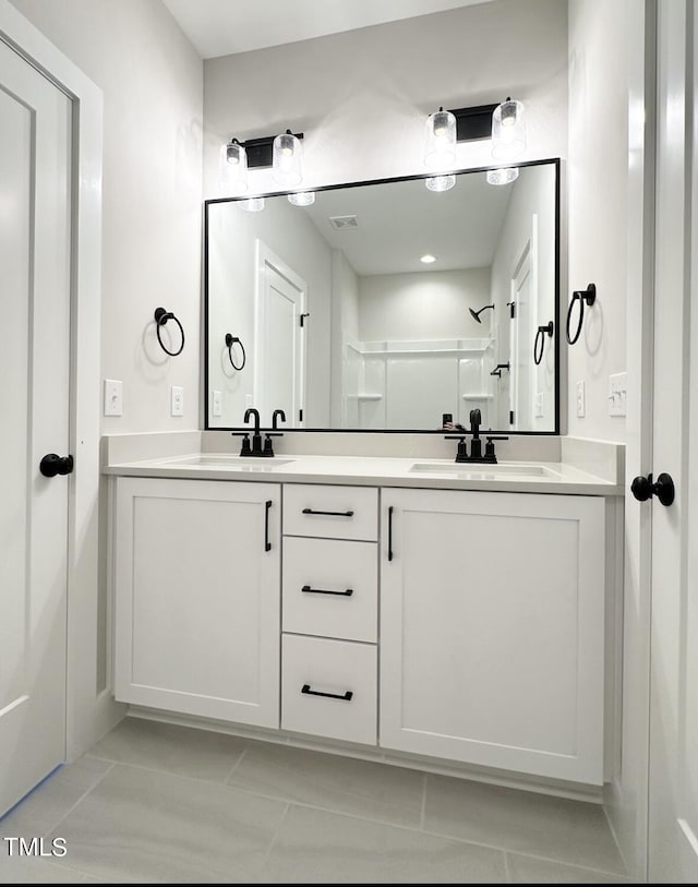 974 Double Helix Rd, Apex, NC 27523 - bathroom featuring double vanity and a shower