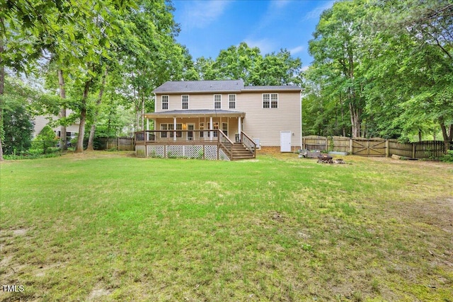 618 Durwood Dr, Raleigh, NC 27603 - rear view of property with a fire pit