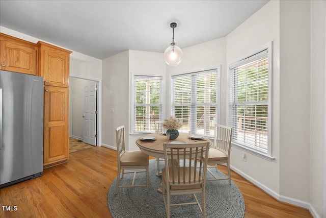 618 Durwood Dr, Raleigh, NC 27603 - dining area with light wood-type flooring and baseboards