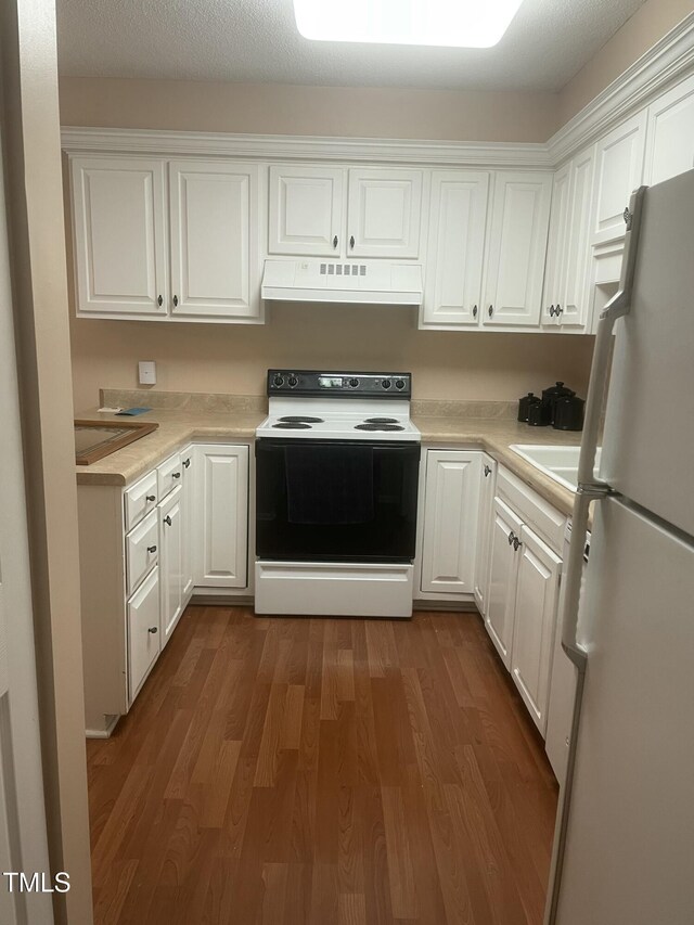 1913 Rendall St, Burlington, NC 27215 - kitchen featuring electric stove, range hood, freestanding refrigerator, and white cabinets