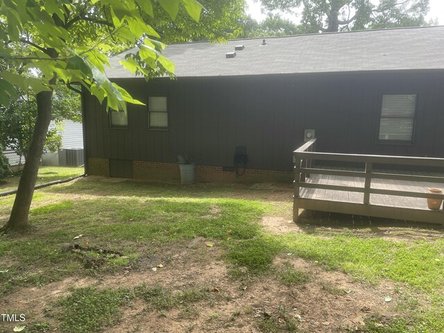 1913 Rendall St, Burlington, NC 27215 - view of yard featuring a wooden deck and central AC