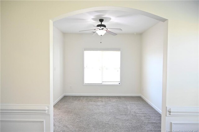 579 Wedgefield Dr, Raeford, NC 28376 - unfurnished room with ceiling fan, carpet floors, arched walkways, and baseboards