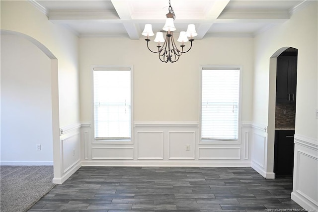 579 Wedgefield Dr, Raeford, NC 28376 - unfurnished dining area with arched walkways, beam ceiling, plenty of natural light, a chandelier, and coffered ceiling