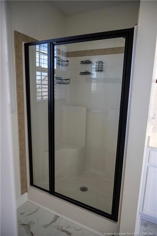579 Wedgefield Dr, Raeford, NC 28376 - full bath featuring a shower stall, marble finish flooring, and baseboards