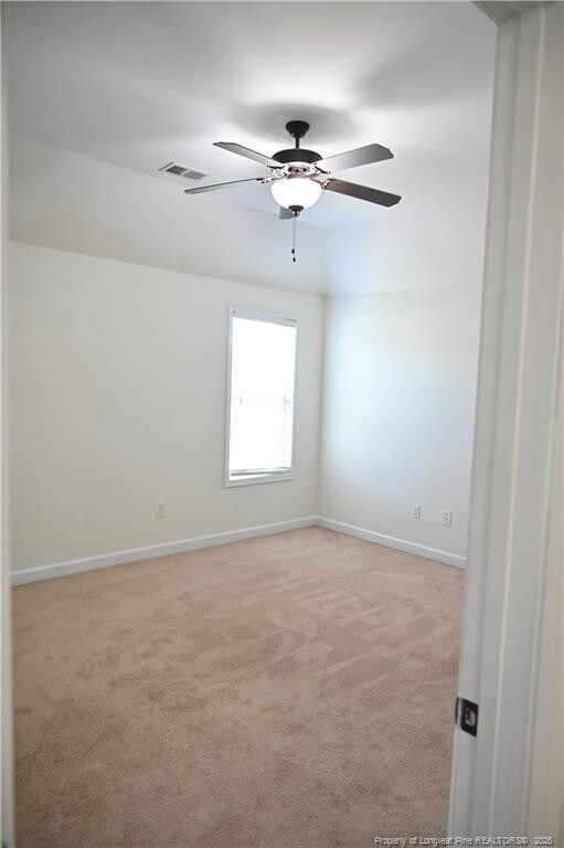 579 Wedgefield Dr, Raeford, NC 28376 - spare room featuring light colored carpet, baseboards, and ceiling fan