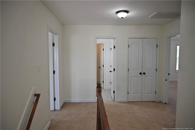 579 Wedgefield Dr, Raeford, NC 28376 - corridor featuring light colored carpet and baseboards