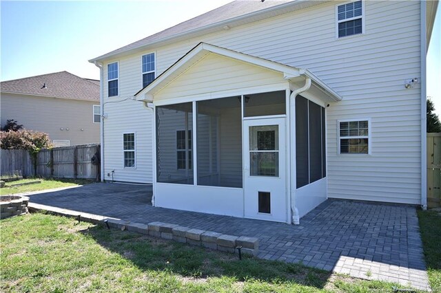 579 Wedgefield Dr, Raeford, NC 28376 - back of property featuring a sunroom and a patio