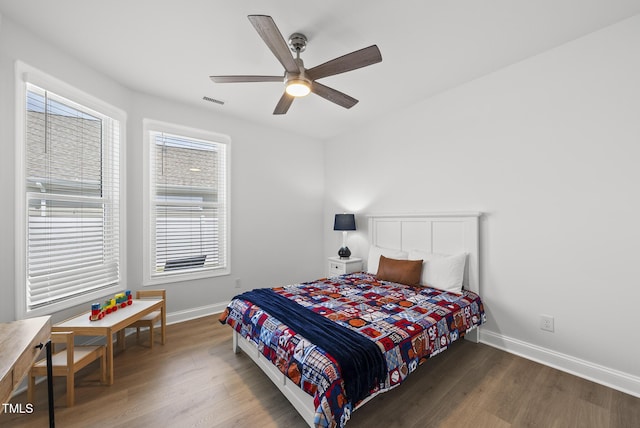 1727 Pinecliff Ct, Fuquay Varina, NC 27526 - bedroom featuring wood finished floors, multiple windows, and ceiling fan