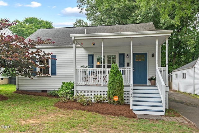 1826 Northgate St, Durham, NC 27704 - view of front of property with a porch, roof with shingles, and a front lawn