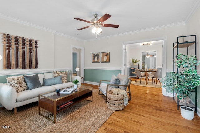 1826 Northgate St, Durham, NC 27704 - living room with a ceiling fan, light wood-style flooring, and crown molding