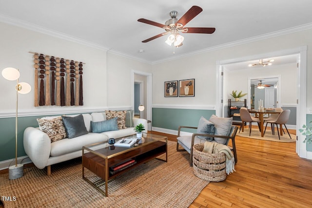 1826 Northgate St, Durham, NC 27704 - living area with a ceiling fan, crown molding, light wood-style flooring, and baseboards