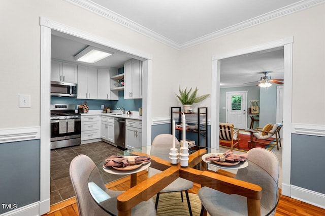 1826 Northgate St, Durham, NC 27704 - dining area with ornamental molding, ceiling fan, and baseboards