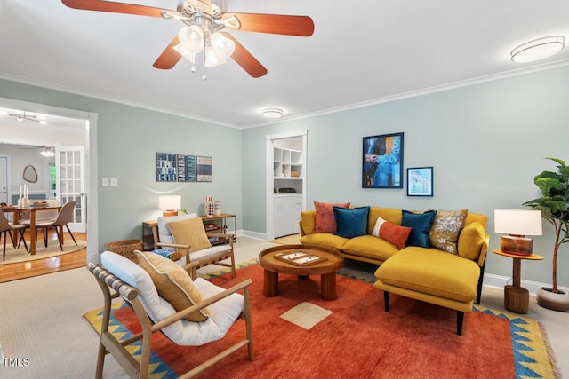1826 Northgate St, Durham, NC 27704 - carpeted living area featuring a ceiling fan, washing machine and clothes dryer, and ornamental molding