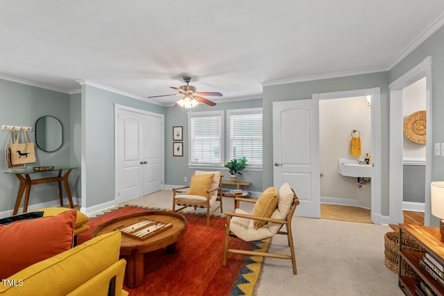 1826 Northgate St, Durham, NC 27704 - living area featuring a ceiling fan, ornamental molding, baseboards, and light colored carpet