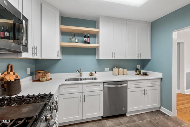 1826 Northgate St, Durham, NC 27704 - kitchen featuring stainless steel appliances, a sink, white cabinets, light countertops, and open shelves